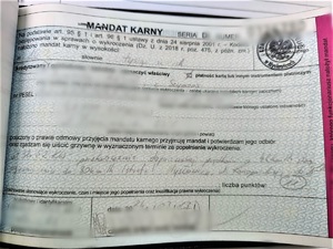 zdjęcie przedstawia zanonimizowany mandat karny